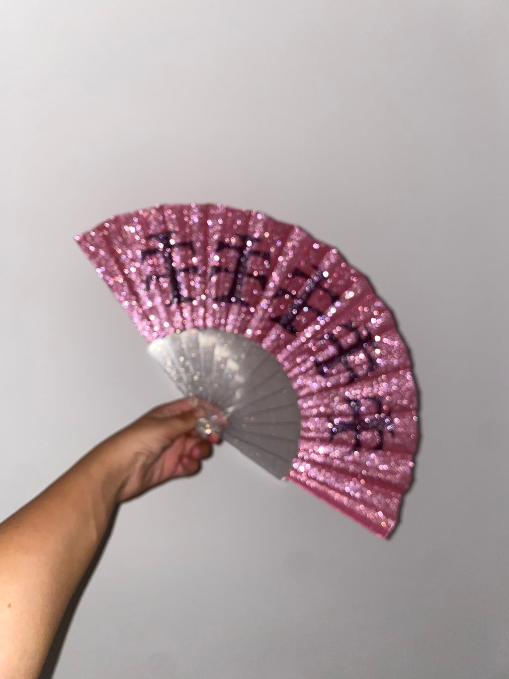 Pink glitter fan black cross
